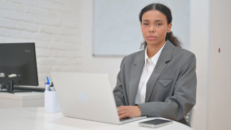 African Business Woman Looking at Camera in Officeの写真素材