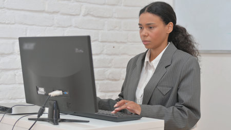 African Business Woman Working on Desktop Computerの写真素材