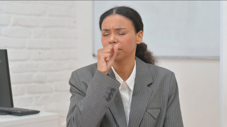 Portrait of Coughing African Business Womanの写真素材