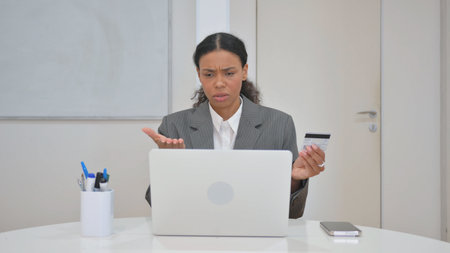 African Business Woman Reacting to Online Shopping Failureの写真素材