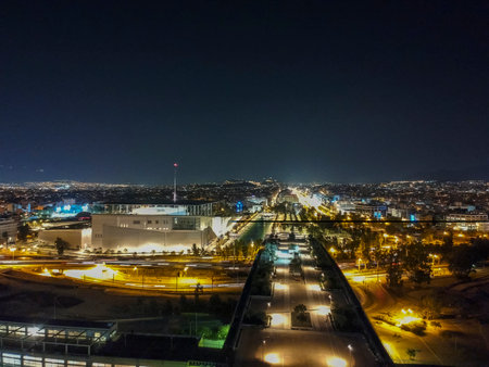 Aerial cityscape view of southern Athens at night. Centered the Foundation of Stavros Niarchos, SNFCC, culture center architecture design, Athens, Greeceのeditorial素材