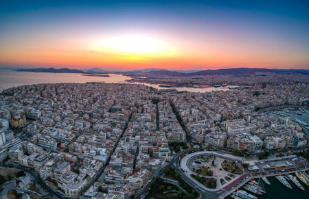 Aerial panorama view over the famous Marina Zeas, Peiraeus at sunset. Marina Zeas is a small crowded circular port with boats docked in Peiraeus city and a top tourist attraction in Greece.のeditorial素材
