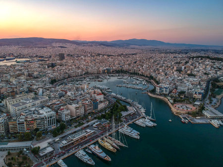 Aerial panorama view over the famous Marina Zeas, Peiraeus at sunset. Marina Zeas is a small crowded circular port with boats docked in Peiraeus city and a top tourist attraction in Greece.のeditorial素材