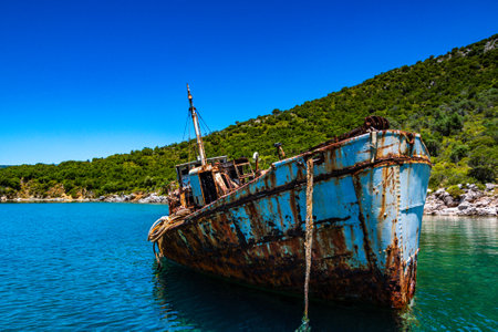 Seaside view over rusty shipwreck of an old cargo ship at Peristera island near Alonissos, Sporades, Greeceの写真素材