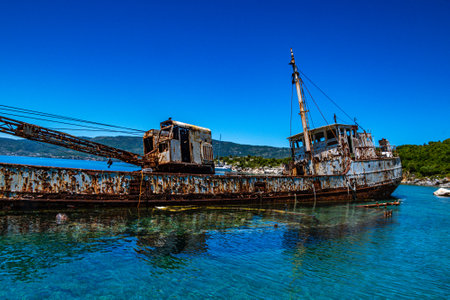Seaside view over rusty shipwreck of an old cargo ship at Peristera island near Alonissos, Sporades, Greeceの写真素材