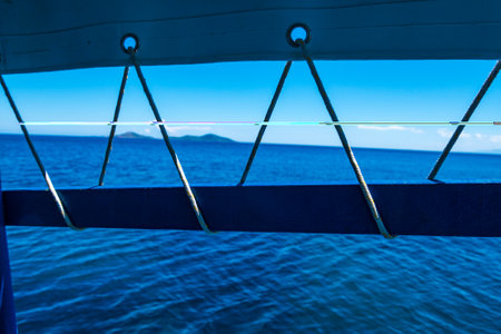 Details of a traditional wooden fishing boat in Greek colours, during boating on the Aegean Sea, Sporades, Greeceの写真素材