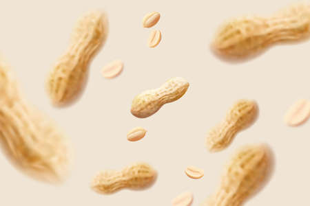 Peanuts and nut pods falling on beige background in 3d illustration, used for design element