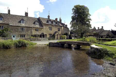 Village stream and cottages                             の写真素材