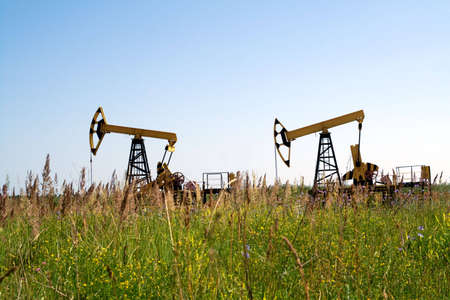 Oil pumpjack against brightの写真素材