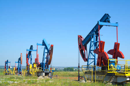 oil pump jacks working at dawn. の写真素材
