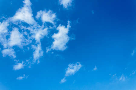 White clouds on a blue and clear sky without precipitation.の写真素材