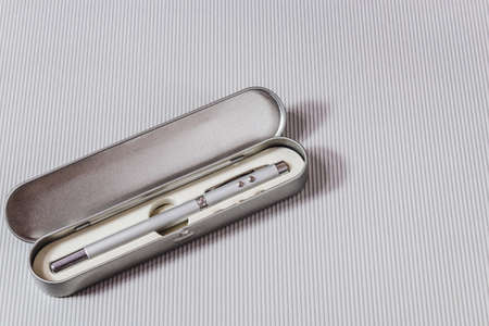 Telescopic pen with laser pointer for teaching and presentation on a light background.の写真素材