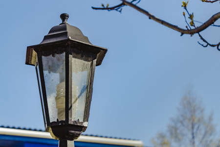 Classic street lamp on a warm summer day under the sun.