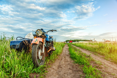 Retro motorcycle trailer on country roadの写真素材