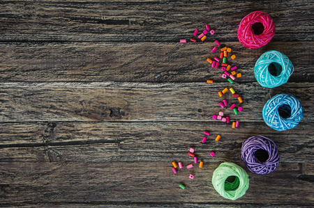 Colorful beads on wooden background above viewの写真素材