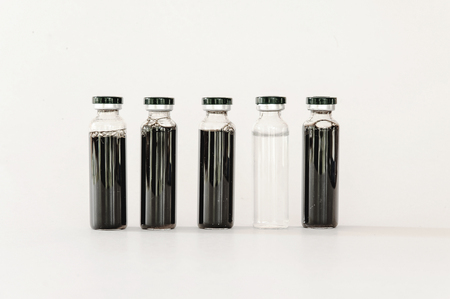 Medical vials with black colored extractの写真素材