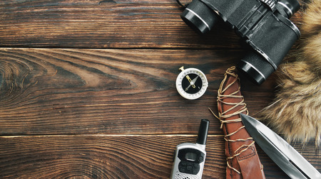 Equipment for hunting or trekking on wooden backgroundの写真素材