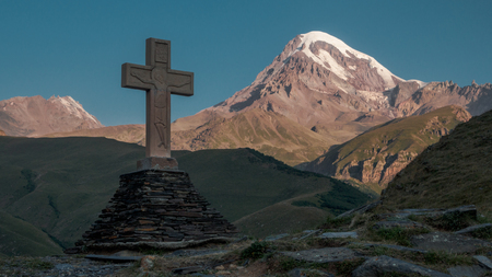 Cross in Kazbegi with view of mountain Kazbek. Georgiaの写真素材