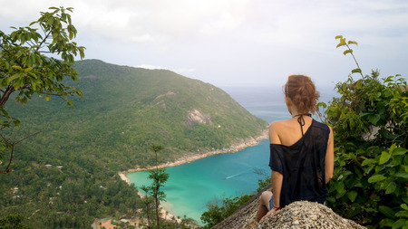 girl enjoy picturesque view of the island at a height. viewpointの写真素材