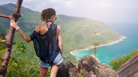 girl enjoy picturesque view of the island at a height. viewpointの写真素材