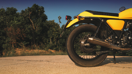 motorcycle parked on the road, rear sideの写真素材