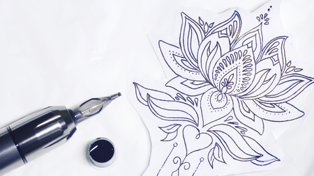 tattoo gun, stamp and some ink for tattoo.の写真素材