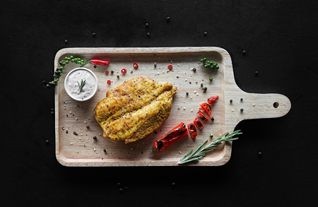Grilled chicken fillets and vegetables, top viewの写真素材