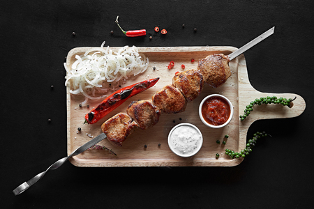 Appetizer pork kebab with vegetables, top viewの写真素材