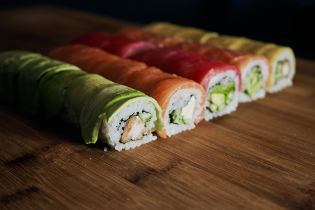 Various kinds of sushi served on wooden tableの写真素材