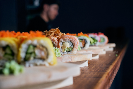 Various kinds of sushi served on wooden tableの写真素材