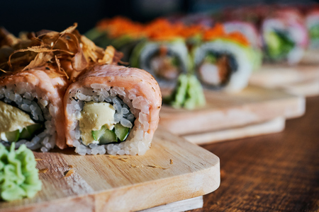 Various kinds of sushi served on wooden tableの写真素材