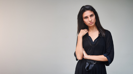 Brunette model girl wearing stylish black dress. Sexy woman portrait with perfect makeup, Beauty trends. panoramic photoの写真素材