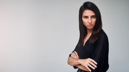 Brunette model girl wearing stylish black dress. Sexy woman portrait with perfect makeup, Beauty trends. panoramic photoの写真素材