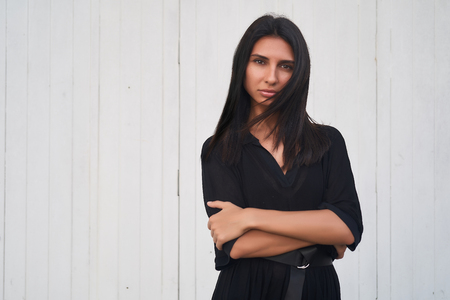 Brunette model girl wearing stylish black dress. Sexy woman portrait with perfect makeup, Beauty trends. panoramic photoの写真素材