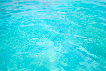 background image of blue water surface, blue sea, wavesの写真素材