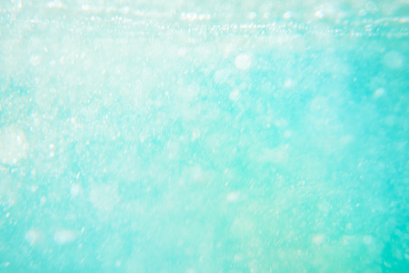 background image of blue water surface, blue sea, bubblesの写真素材