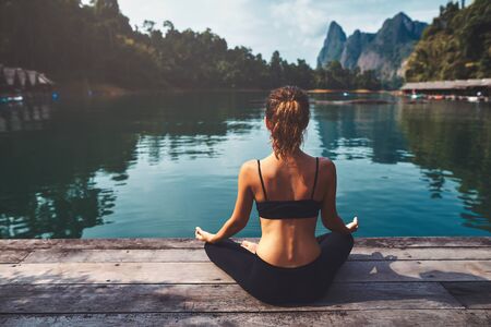 Woman Yoga - relax in natureの写真素材