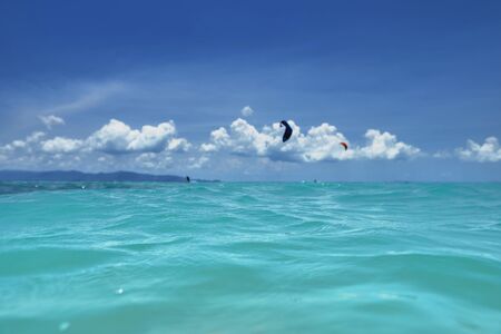 group of kite surfers in the seaの写真素材