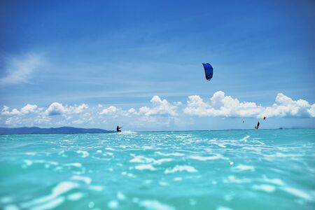 group of kite surfers in the seaの写真素材