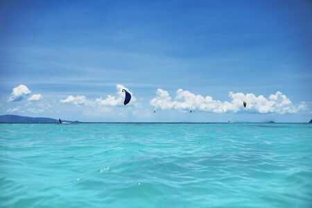 group of kite surfers in the seaの写真素材