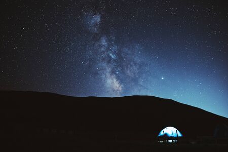 Illuminated camping tent under stars at night. nature reserve Sochiの写真素材