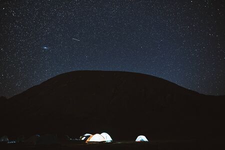 Illuminated camping tent under stars at night. nature reserve Sochiの写真素材