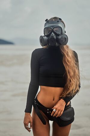 Young woman is wearing a gas maskの写真素材