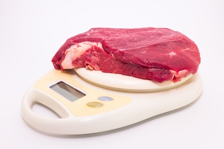 steak on the libra, measuring the meat before cooking or sellingの写真素材