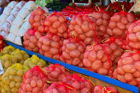 For selling potatoes in bags at the marketの写真素材