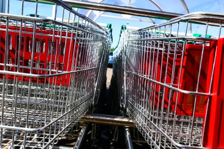 shopping carts outside of supermarket in rows の写真素材