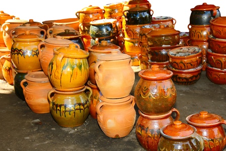 Glazed ceramics are for sale at an outdoor market