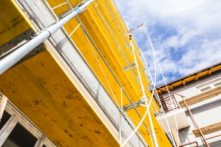 Empty workplace on scaffolding at big house.の写真素材