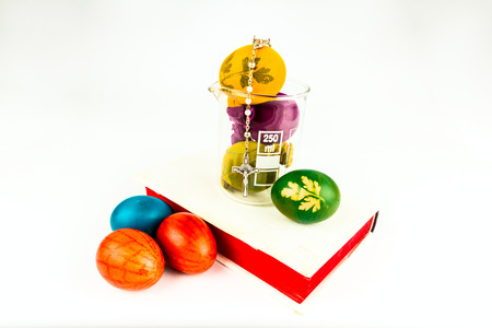 Decorated Easter eggs in a lab glass, new technologies in old customs labeled with holy wisdom