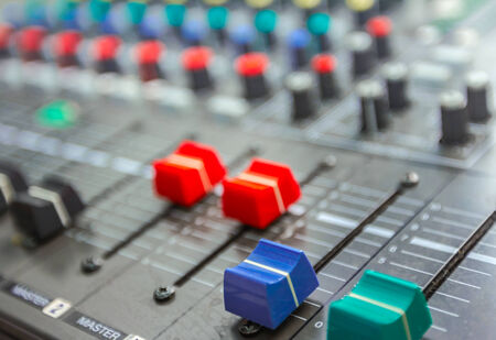 Sound studio adjusting record equipment, music mixer